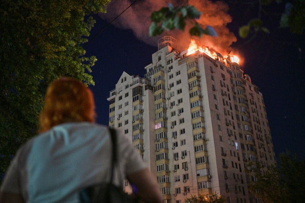 An apartment building burns after an hours-long Russian missile and drone attack on Kyiv on July 2, 2026.